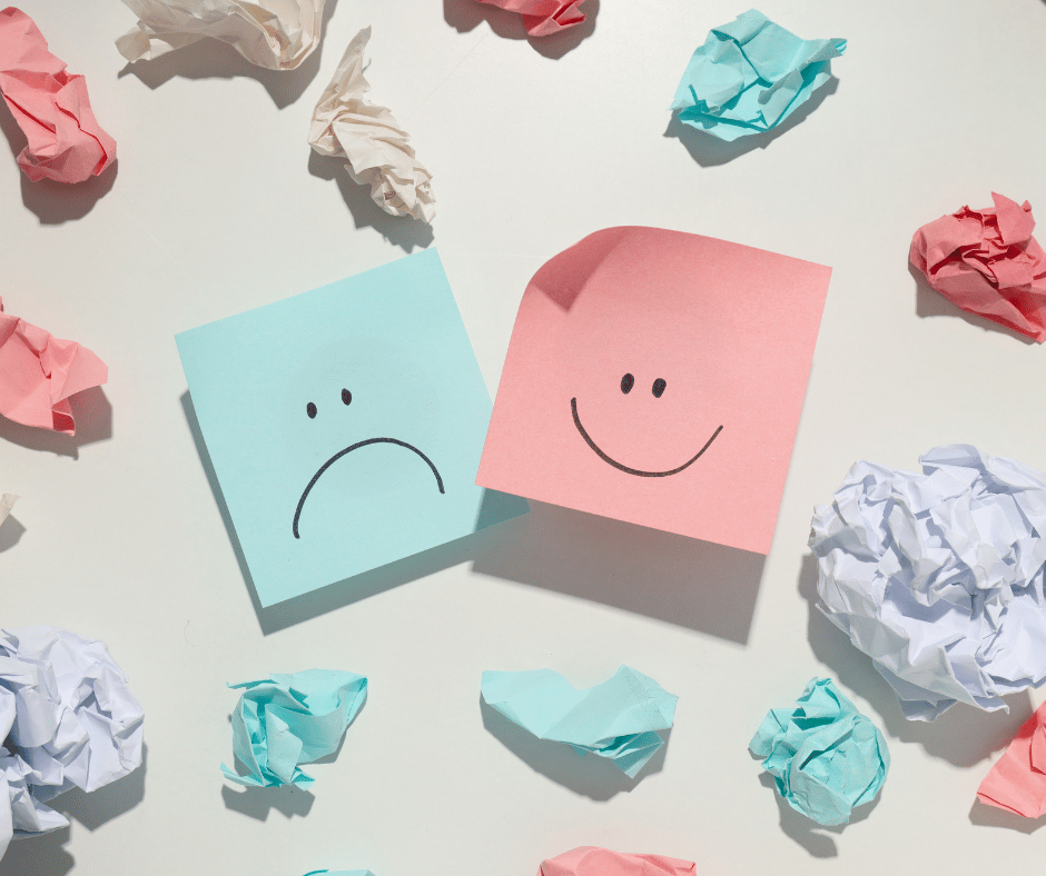 post its with happy and sad faces